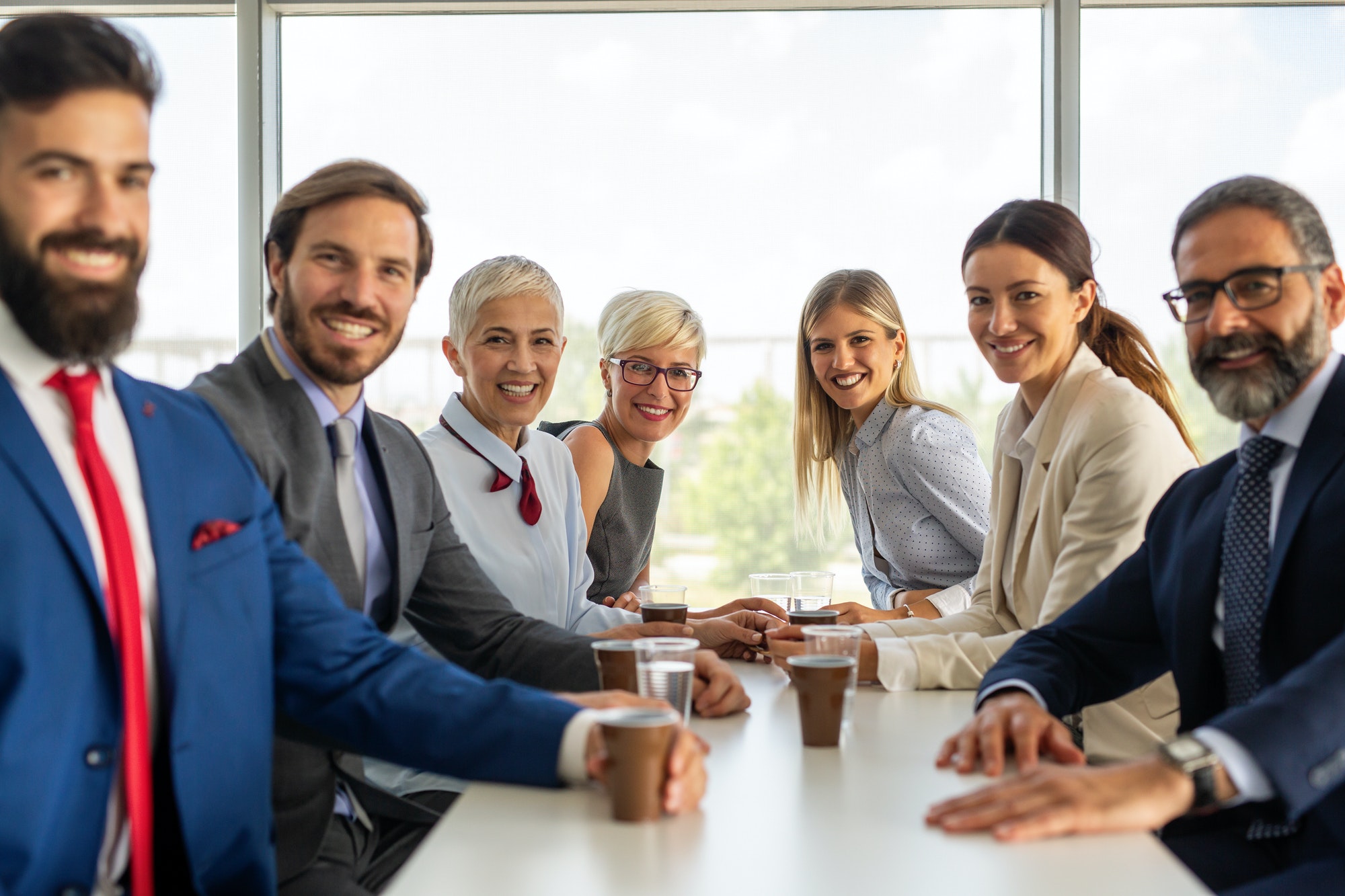 portrait-of-successful-business-team-posing-in-office.jpg