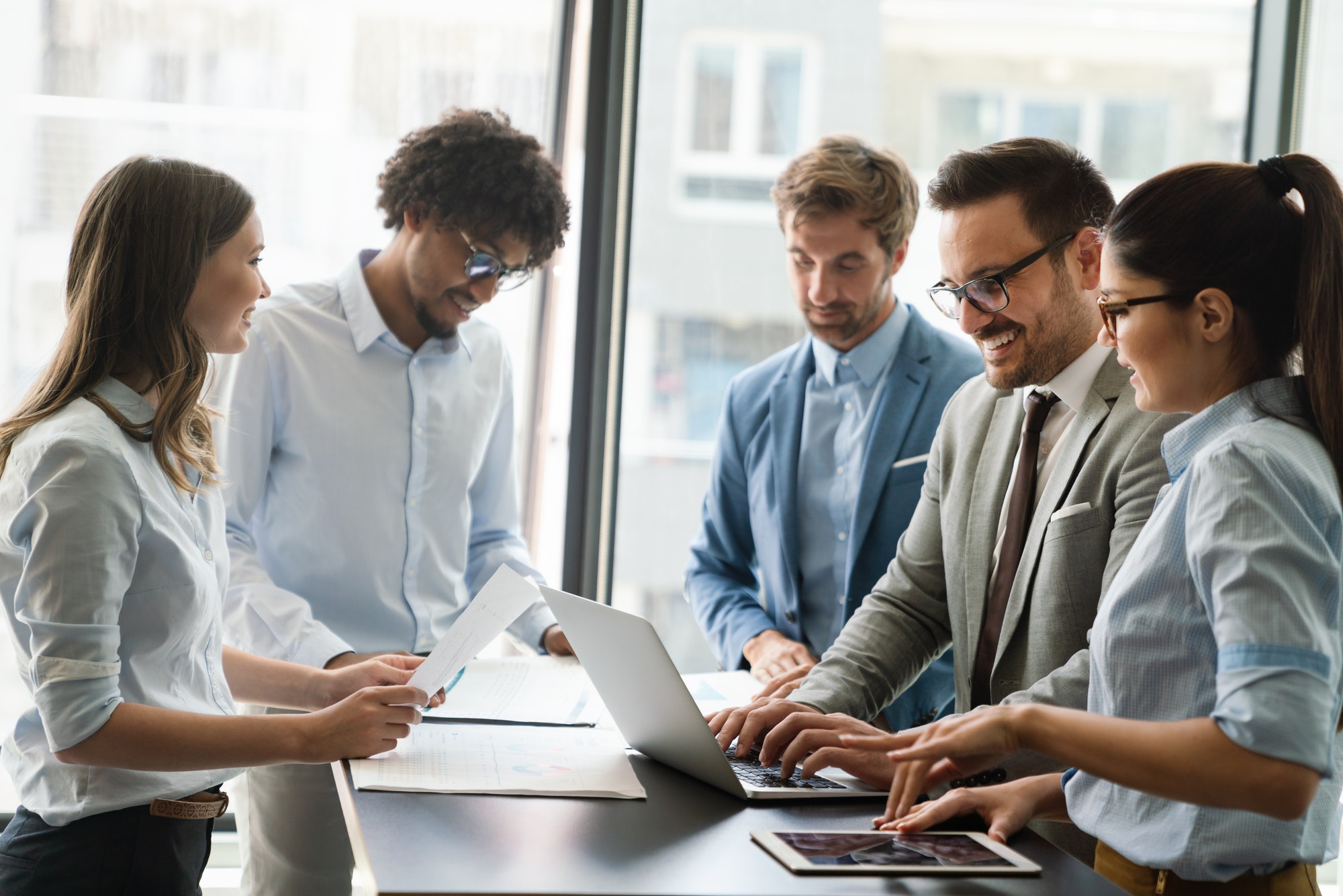 portrait-of-successful-business-team-working-in-office-1.jpg